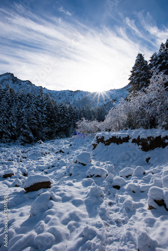 It is a snow scene at Mt. Akadake in Yatsugatake, Japan. It is the scenery of the sunrise in winter.