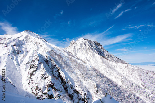 It is a snow scene at Mt. Akadake in Yatsugatake, Japan. It is the scenery of the sunrise in winter.