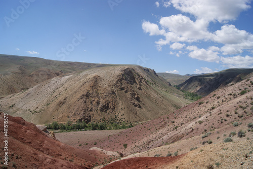 An unusual natural area in the Altai mountains with colored soil similar to the Martian landscape. Natural attraction of Altai. Popular tourist routes in Russia.