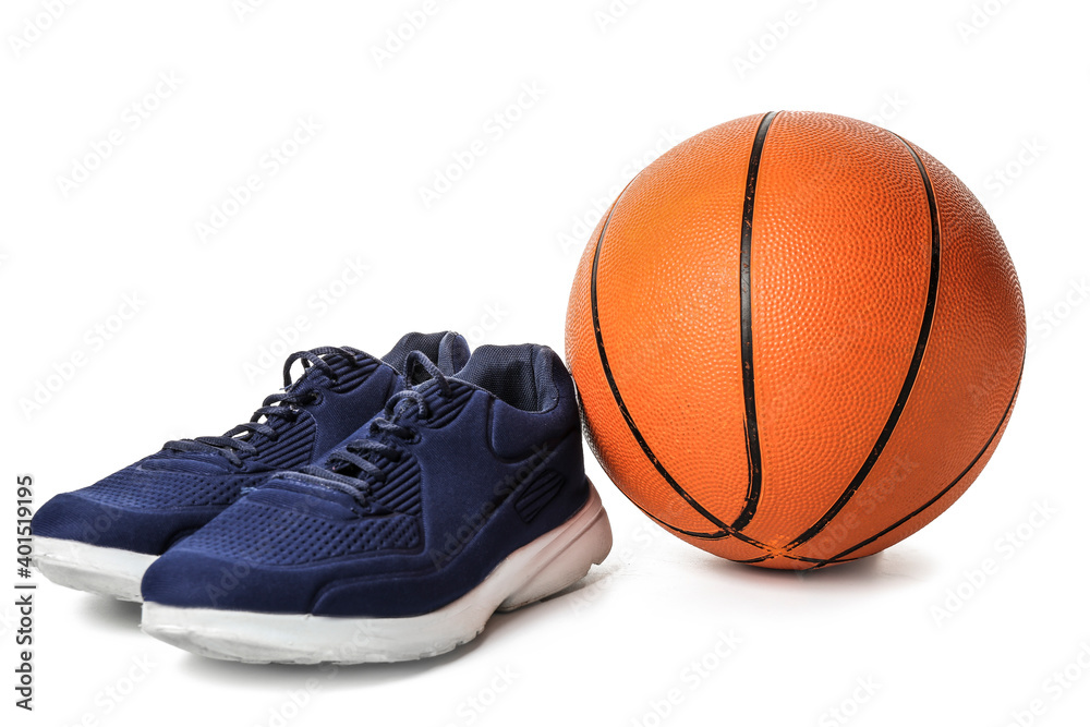 Stylish male shoes and basketball on white background