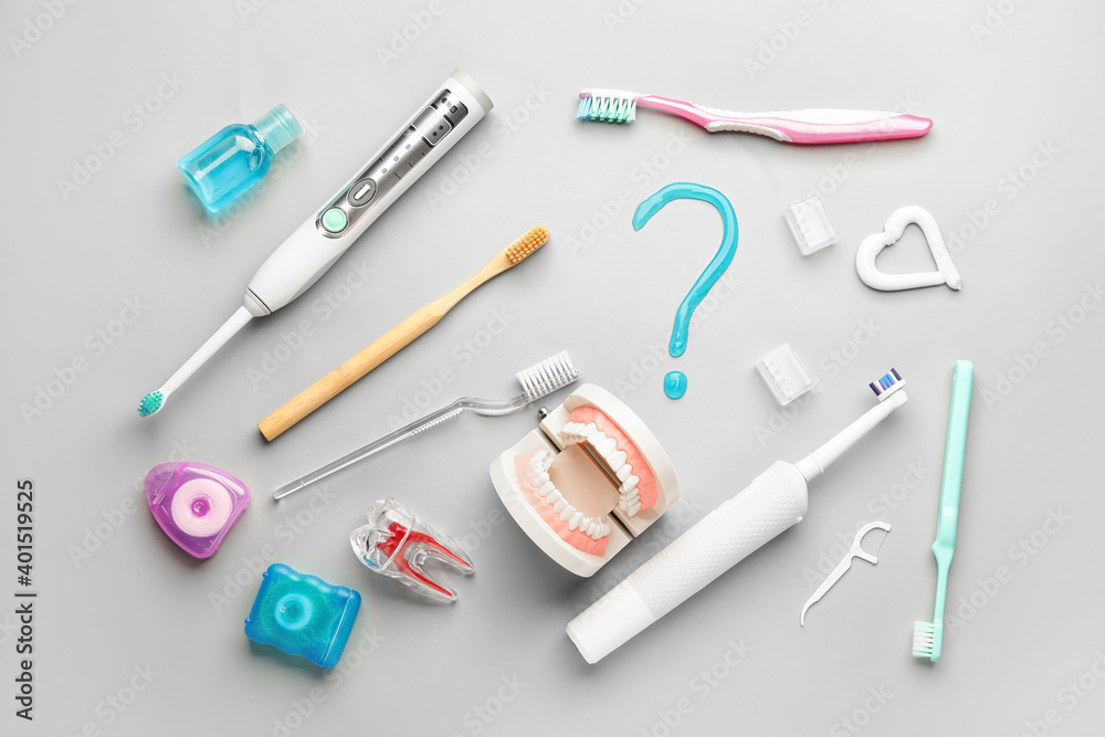Set of oral hygiene and question mark on light background Set of oral hygiene and question mark on light background