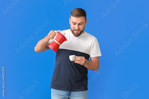 Handsome young man drinking...