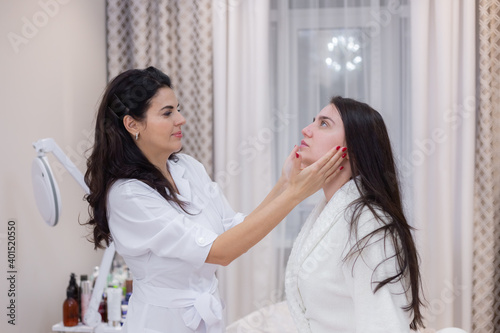 Wallpaper Mural A client at a beautician's appointment, consultation, face shaping, preparation for upcoming procedures, visual examination of problem areas Torontodigital.ca