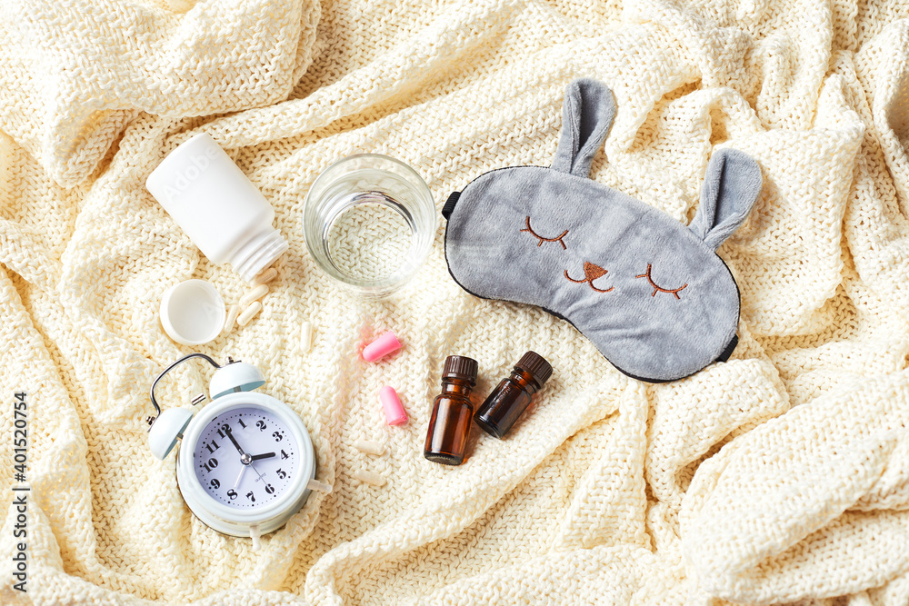 Sleeping mask, alarm clock, earplugs and pills. Healthy night sleep  creative concept. Stock Photo | Adobe Stock