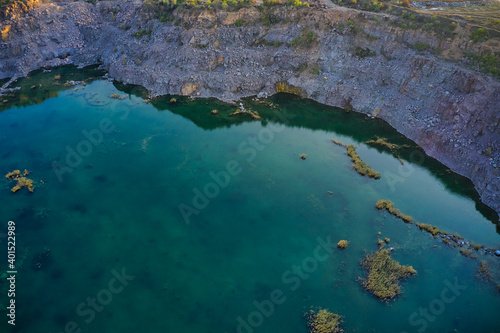 Old flooded stone quarry, site of natural granite stone mining © YouraPechkin