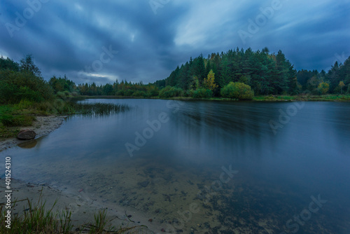 Small forest lake on a cloudy night  inBelarus