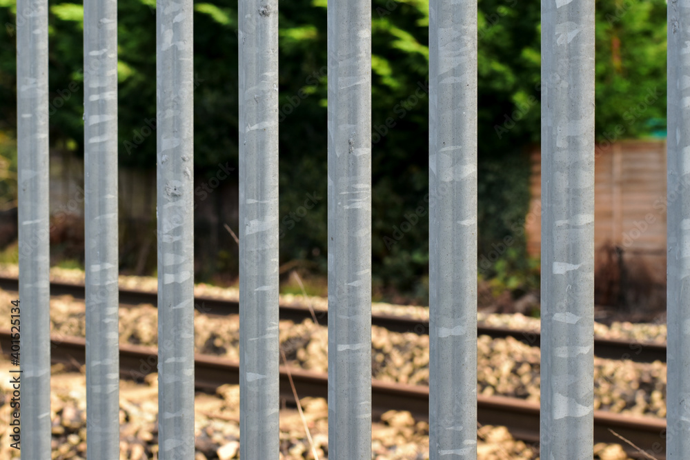 Metal fence near a railroad, Coventry, England
