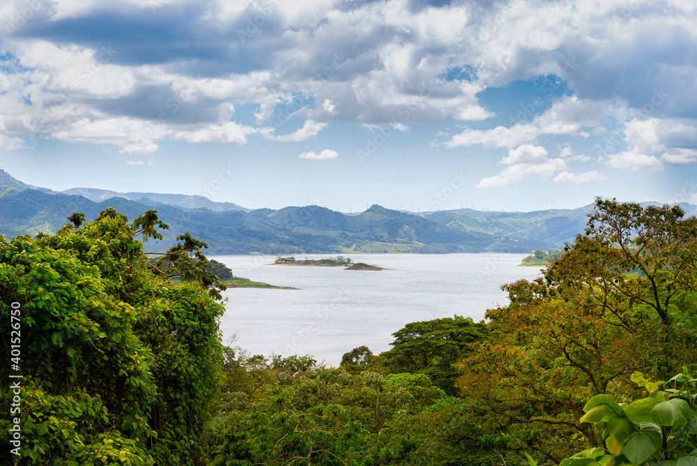 Amazing view of beautiful nature of Costa Rica with lake and forest near volcano Arenal in summer. La Fortuna, Costa Rica. Central America. Amazing view of beautiful nature of Costa Rica with lake and forest near volcano Arenal in summer. La Fortuna, Costa Rica. Central America.
