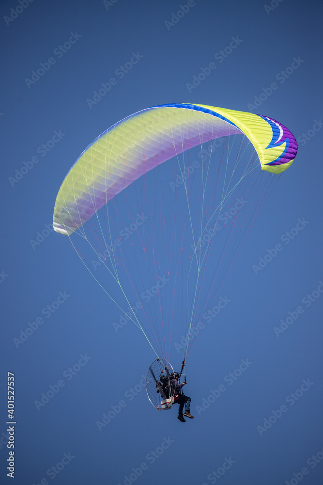 motor glider in blue sky