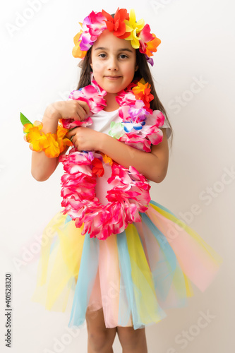 little girl in hawaiian costume isolated white background