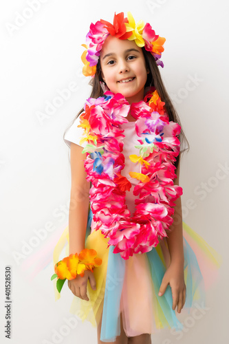 Cute girl in Hawaiian style clothes on white background
