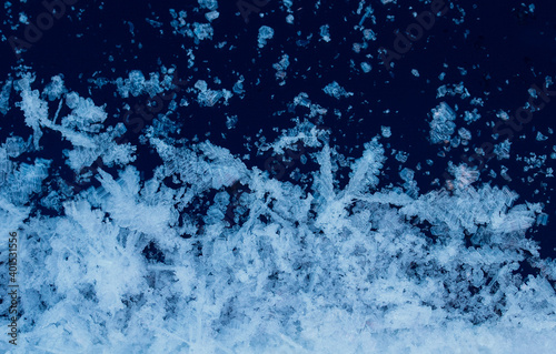 winter background frame with shiny white crystals of snowflakes and frost on ...
