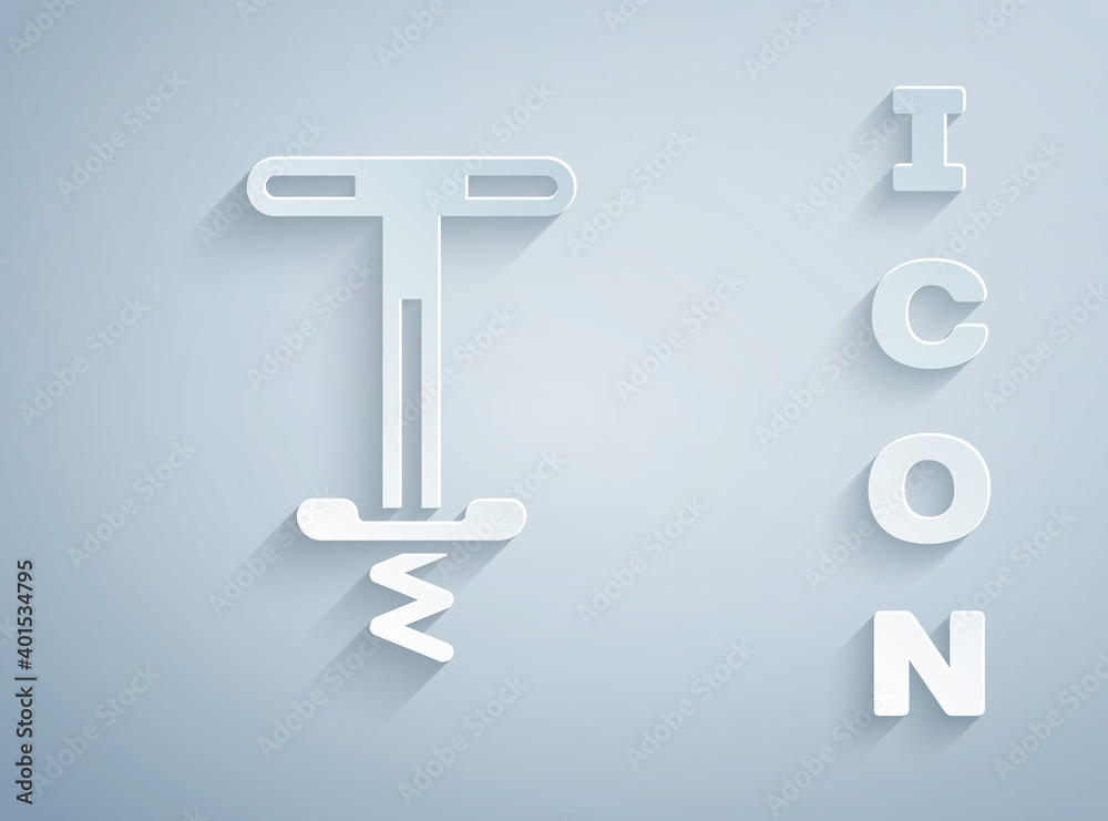 Paper cut Pogo stick jumping toy icon isolated on grey background. Paper art style. Vector.