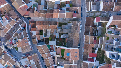 Aerial top view of rooftops of white houses in typical Andalusian town in south Spain