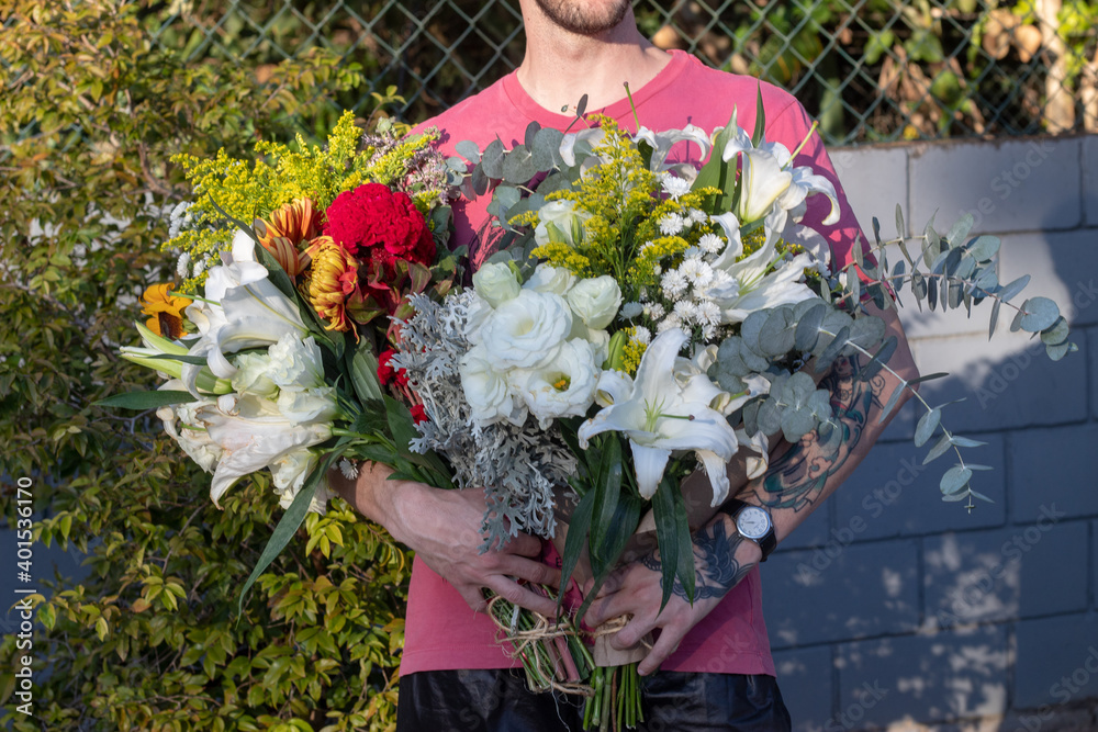 Fototapeta premium person with bouquet of flowers