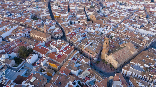 Central streets of big town in South Spain seen from above. Aerial views of the Antequera church