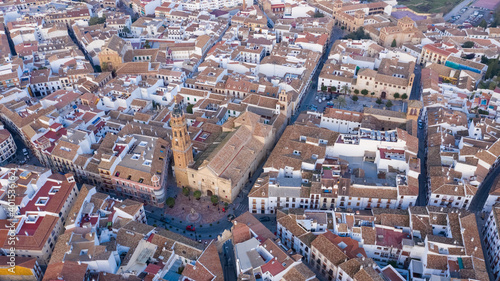 Central streets of Antequera seen from above. Aerial view of typical Spanish town in Andalusia with christian churches