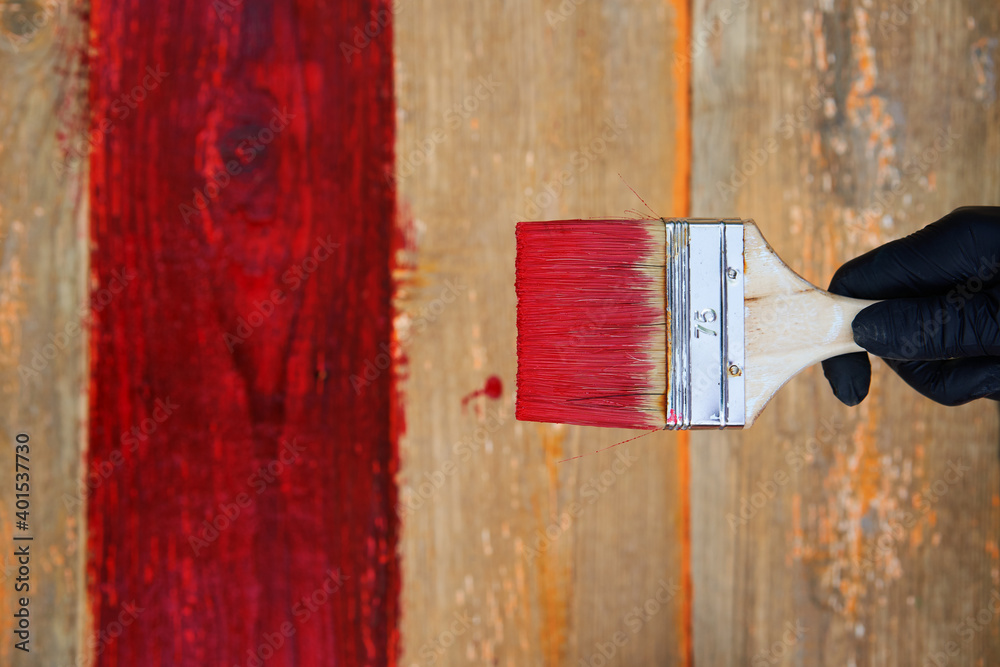 Painting brush on the old wooden background.