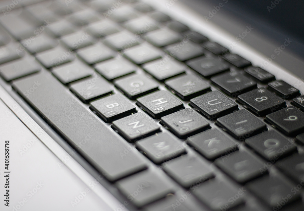 Laptop keyboard black on gray background. Close-up of laptop keyboard. Laptop keyboard black on gray background. Close-up of laptop keyboard.