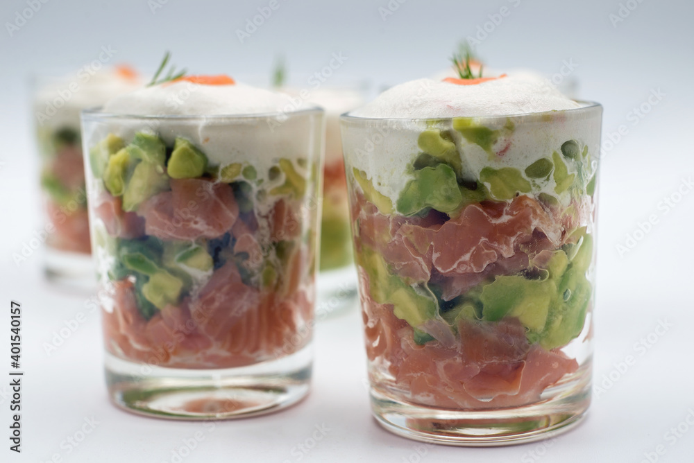 closeup of appetizers in little glasses on white background closeup of appetizers in little glasses on white background