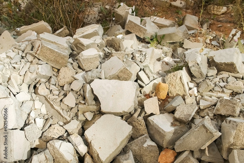 Construction debris on site with broken panels and bricks, closeup view. Construction dump with garbage. Environmental pollution and problem.
