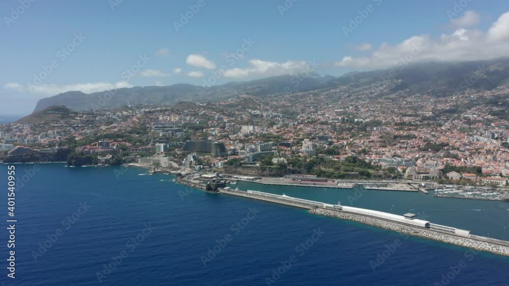 Aerial of picturesque Funchal city on Madeira island during sunny day Aerial of picturesque Funchal city on Madeira island during sunny day