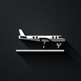 Silver Plane icon isolated on black background. Flying airplane icon. Airliner sign. Long shadow style. Vector.