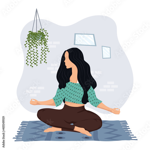 young woman practicing yoga in the house