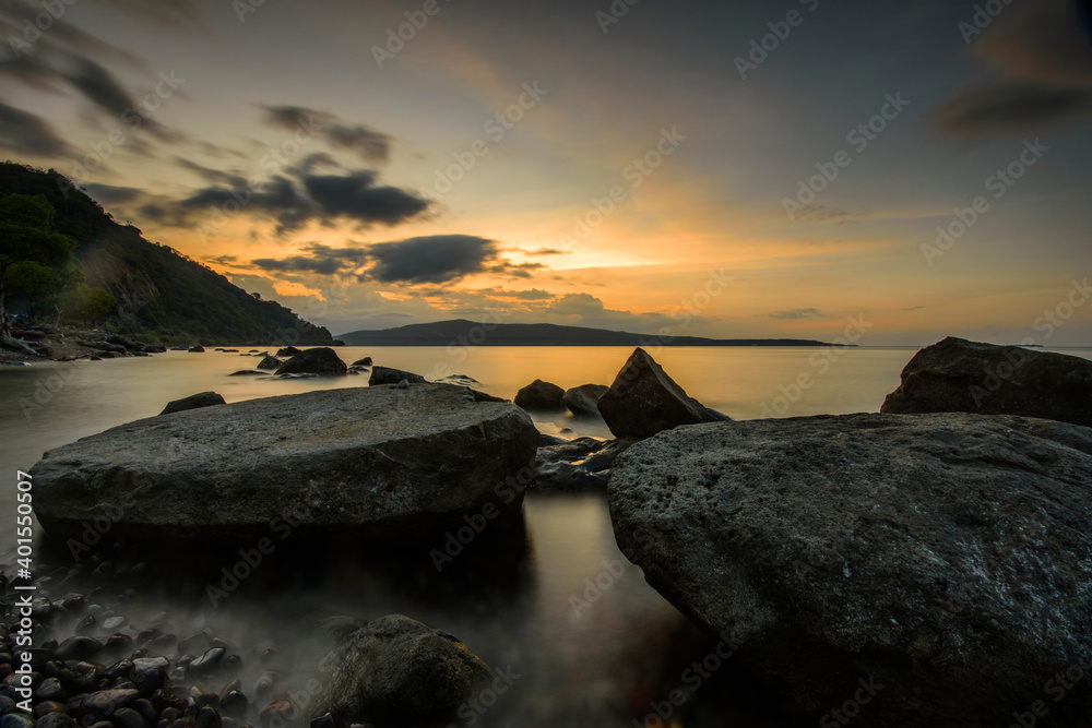 Twilight on Likwatang beach with big stones