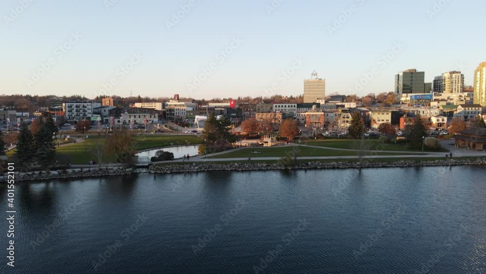 Barrie, Ontario, Canada - Nov 8, 2020: City of Barrie waterfront and downtown aerial drone dolly shot with Lake Simcoe marina, condo buildings, banks, parks and infrastructure. Clear fall day. Barrie, Ontario, Canada - Nov 8, 2020: City of Barrie waterfront and downtown aerial drone dolly shot with Lake Simcoe marina, condo buildings, banks, parks and infrastructure. Clear fall day.