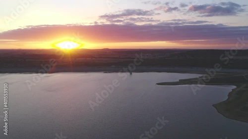 Drone panoramic aerial view of Minutos Dam in Arraiolos Alentejo at sunset, Portugal photo