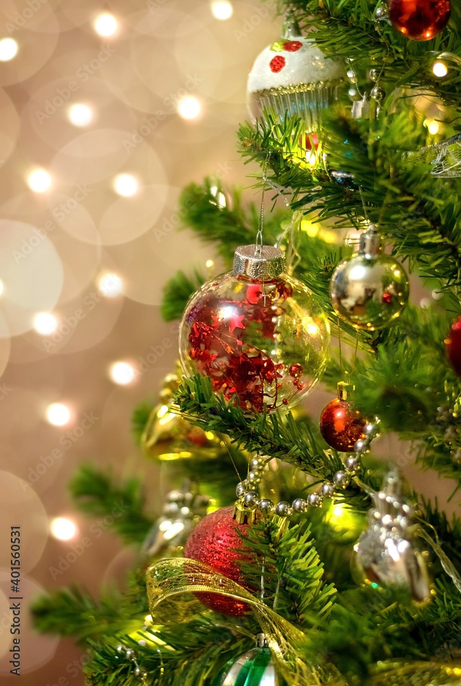 Fototapeta premium Balls on the tree. Bokeh garlands in the background. New year concept.