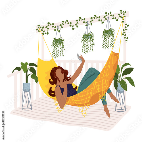 afro young woman taking a selfie in a hammock