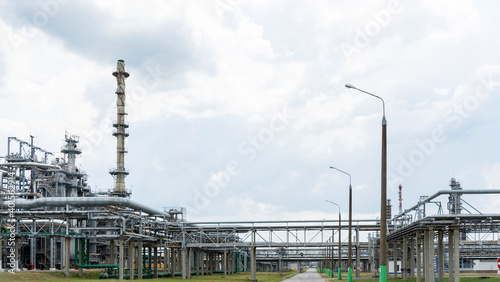 Industrial furnace and heat exchanger cracking hydrocarbons in factory on blue sky background, Close-up of equipment in petrochemical plant. Industry and ecological problem concepts.