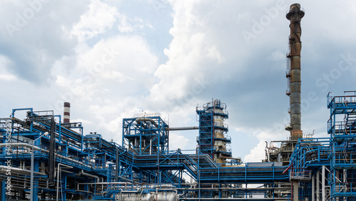 Industrial furnace and heat exchanger cracking hydrocarbons in factory on blue sky background, Close-up of equipment in petrochemical plant. Industry and ecological problem concepts.