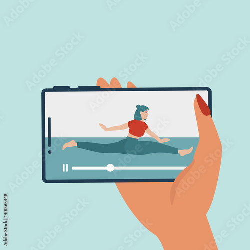 Stay active at home concept. Online coach banner - female personal fitness trainer coming out of phone screen holding. Female hand holding smartphone. Training via Internet video call. 