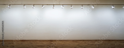 Interior of a empty white wall with spot lights at art gallery photo