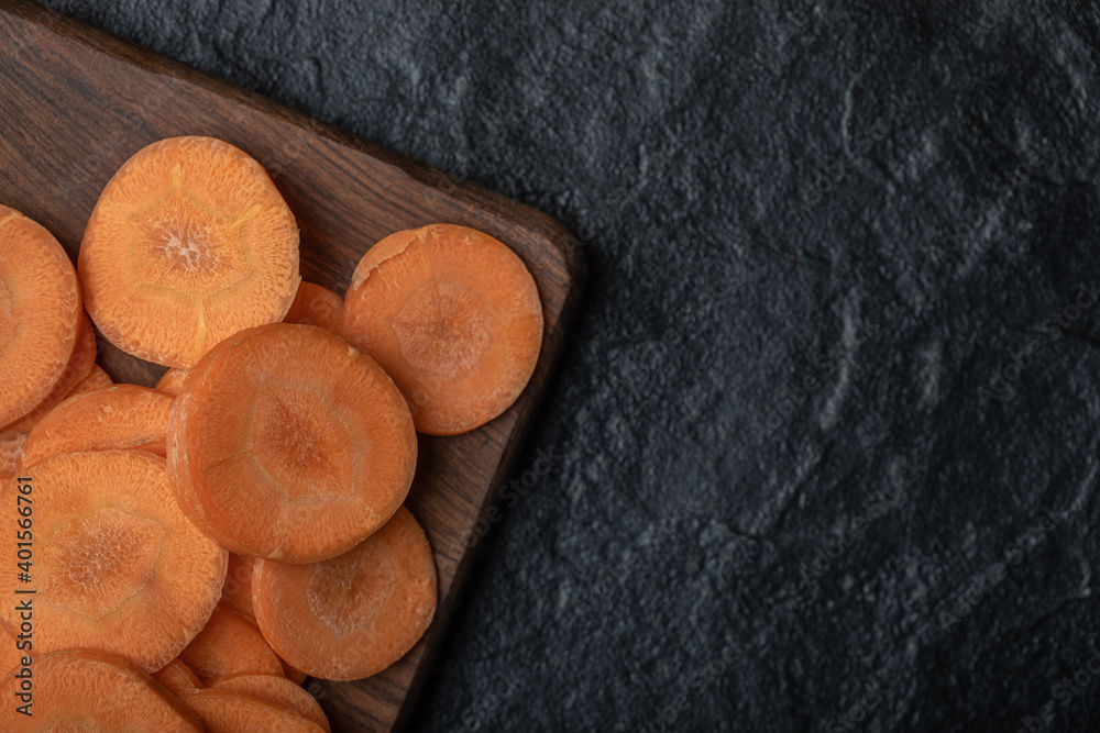 Close up photo of sliced carrots on black background Close up photo of sliced carrots on black background