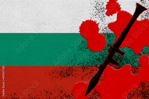 Bulgaria flag and black RPG-7 rocket-propelled grenade launcher in red blood. Concept for terror attack or military operations with lethal outcome photo