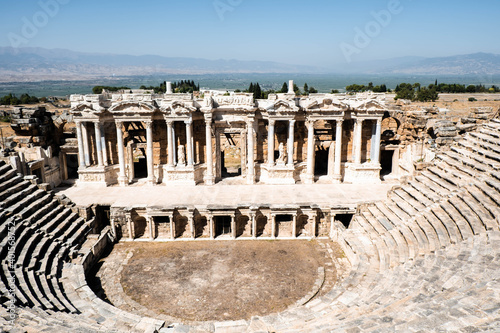 Ancient stage in ruins of Hierapolis Ancient City Theather. Historical ancient city buildings. It's in Pamukkale Town, Turkey
