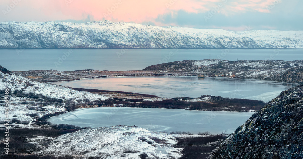 Arctic winter mountain hard-to-reach lakes. Northern wildlife. Panoramic view. Kola Peninsula. Arctic winter mountain hard-to-reach lakes. Northern wildlife. Panoramic view. Kola Peninsula.