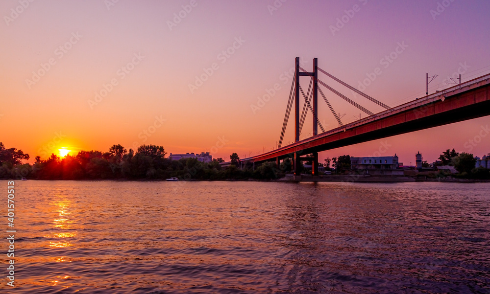 Sunset on Belgrade river named Sava with a huge bridge across the river. Sunset on Belgrade river named Sava with a huge bridge across the river.