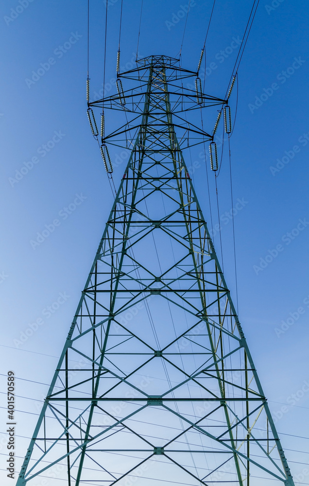 A power line in close up shot with clear blue sky. A power line in close up shot with clear blue sky.