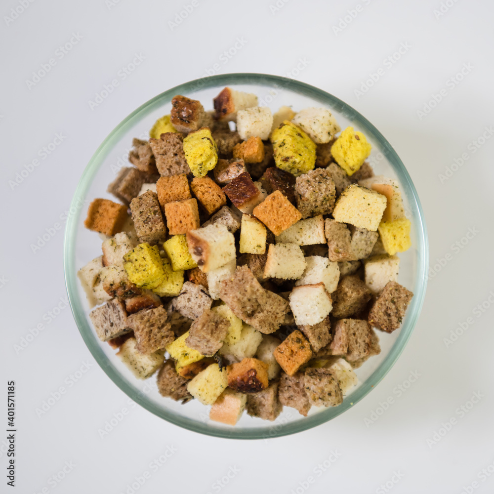 Croutons in a transparent bowl on a white background Croutons in a transparent bowl on a white background