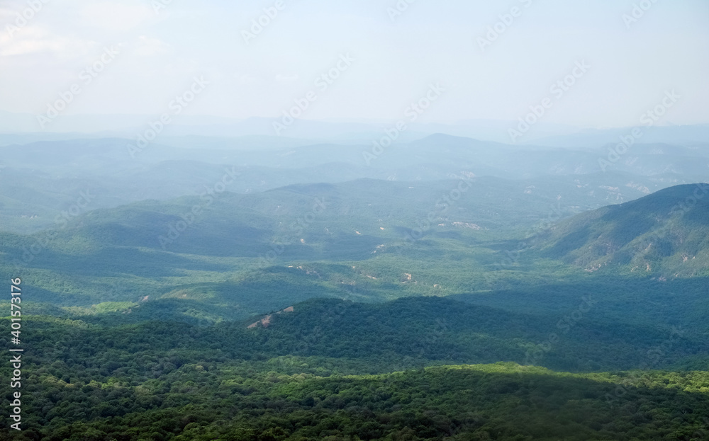 A view of the mountains covered with dense forest from the upper plateau of the Chatyr-Dag mountain range in Crimea.