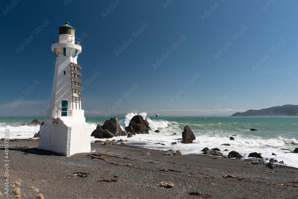 The lower Pencarrow Head lighthouse at the entrance to Wellington Harbour, with Cook Strait in the background. Wellington, New Zealand.