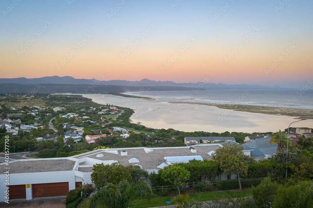 Panoramic view over Plettenberg Bay and Keurboomsrivier, South Africa at sunrise.