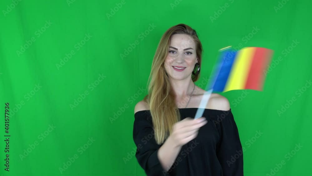 blonde woman waving in front of romania flag green screen
