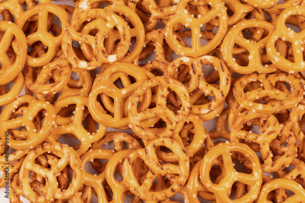 Densely sprinkled crackers with salt on a flat surface Densely sprinkled crackers with salt on a flat surface