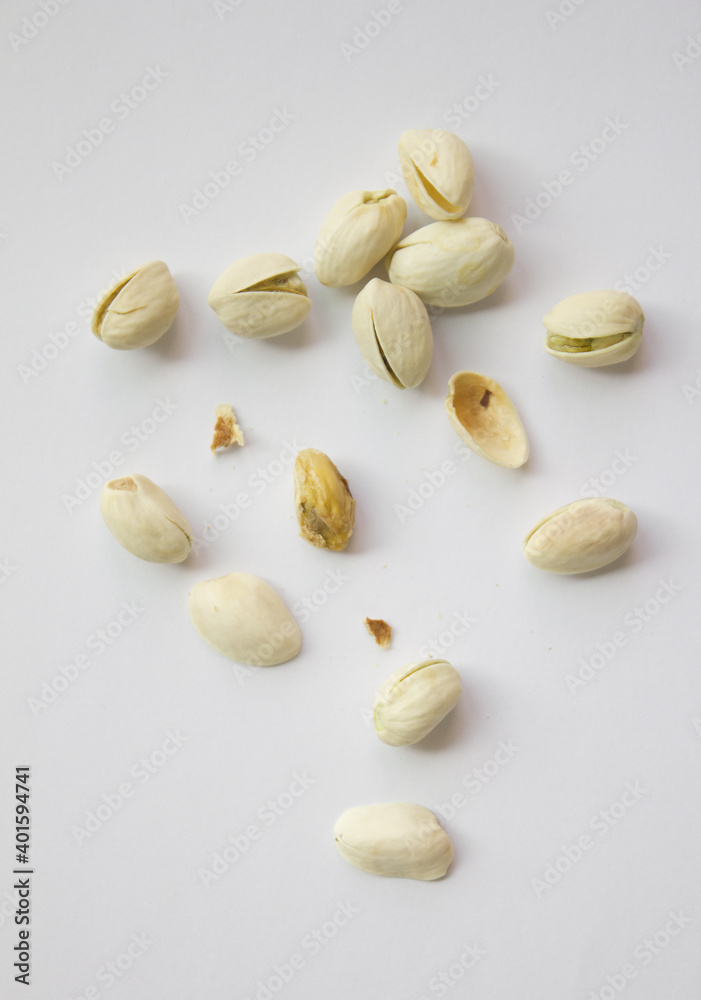Pistachios isolated on white background, top view. 